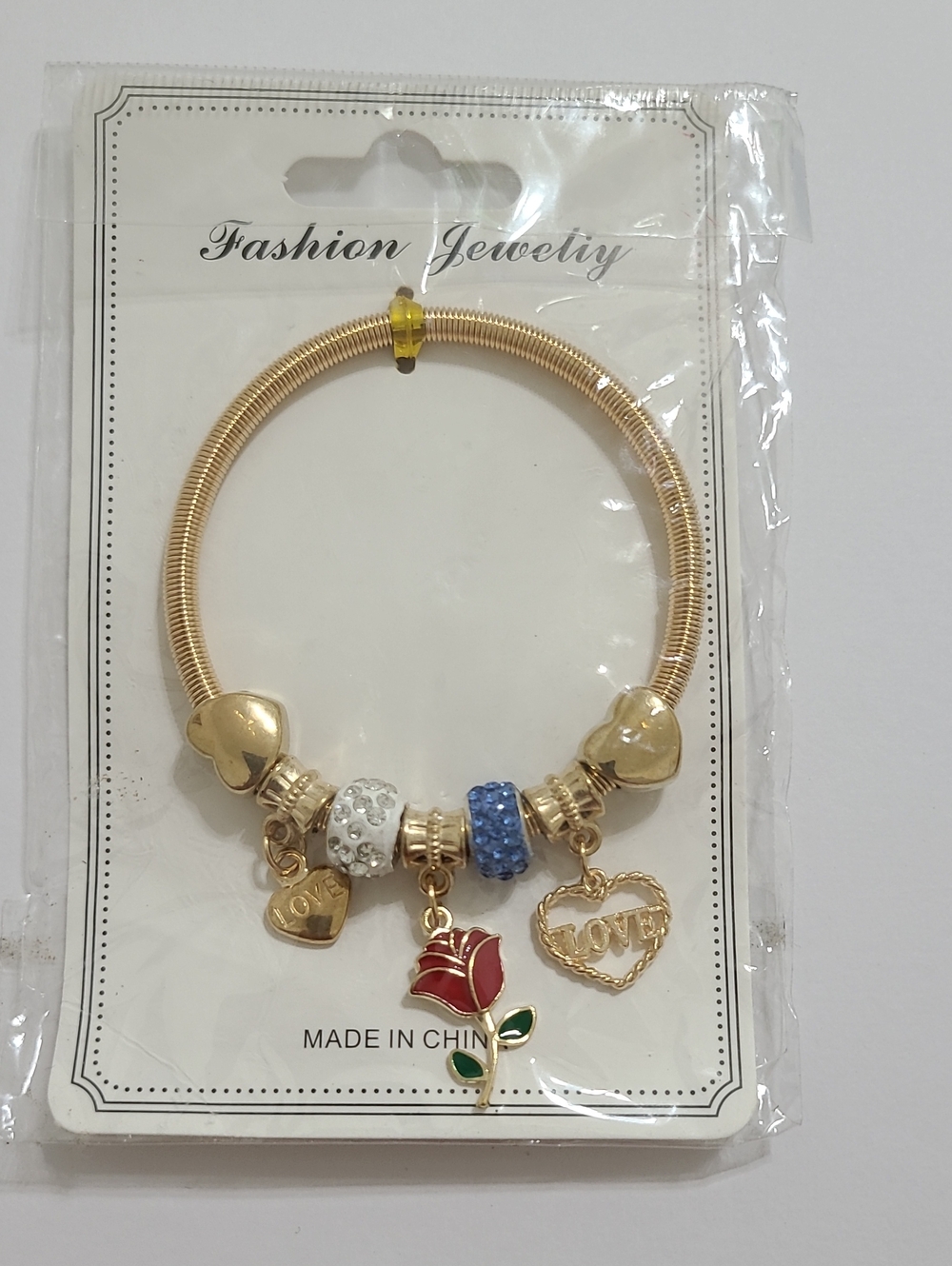 Fashion Jewelry Gold-Tone Bracelet with Clear & Blue Charms, Rose & Heart Charms